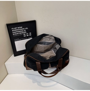 Interior detail of large canvas travel bag showing inner lining and zip pockets