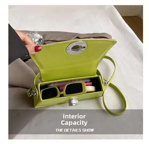 Internal capacity of the neon green PU crossbody bag showing daily essentials