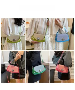 Detail showing various colors of woven texture crossbody box bags with metal locks
