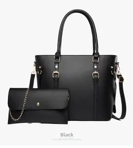 Detail of black pebbled leather tote set with gold-tone hardware and envelope chain pouch