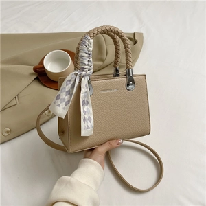 Chic beige litchi pattern square handbag with woven handle and silk scarf detail
