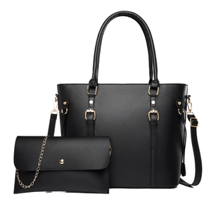 Black leather tote bag and chain pouch set with gold hardware and top handles