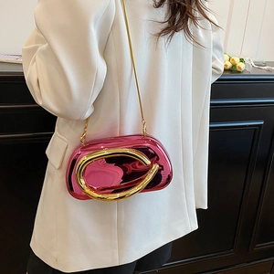 Chic metallic magenta hard shell crossbody bag with a gold ring clasp and chain strap