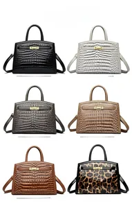Detailed collection of stone pattern and leopard print handbags with gold twist locks