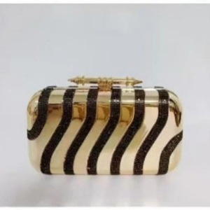 Elegant gold acrylic evening clutch bag with black wave stripes and diamond accents
