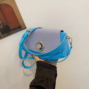 Blue PU leather crossbody bag with striped woven flap and silver round swivel lock