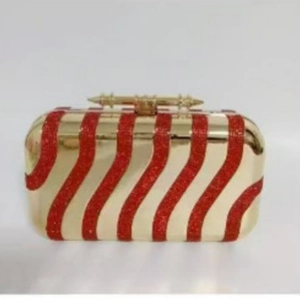 Elegant gold acrylic evening clutch with red sequin wave stripes and top spike closure