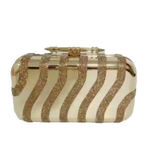 Champagne gold evening clutch bag with sequin waves and knuckle ring clasp handle