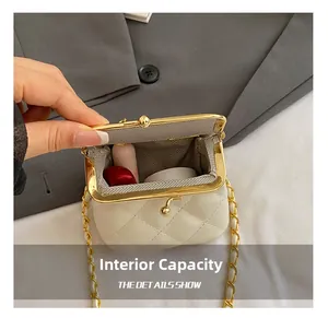 Internal capacity of mini quilted white bag showing storage for lipstick and cushion