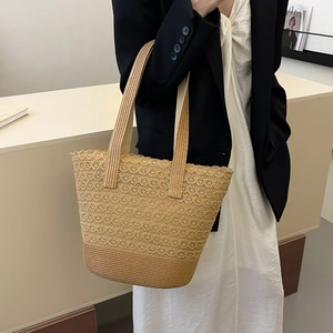 Chic hollowed-out straw tote bag for summer beach travel with large capacity design