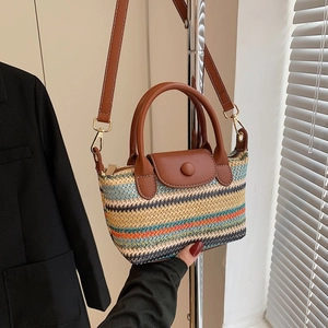 Mini colorful striped woven crossbody bag with brown leather handles and shoulder strap