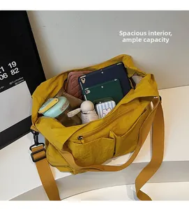 Macro view of bright yellow nylon crossbody bag interior showing spacious large capacity