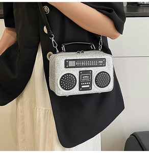 Creative silver glitter radio-shaped crossbody bag shown on model for size and style
