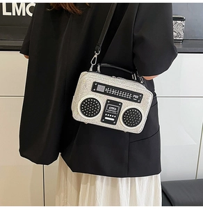 Detail of silver glitter radio box bag showing vintage speaker and dial design