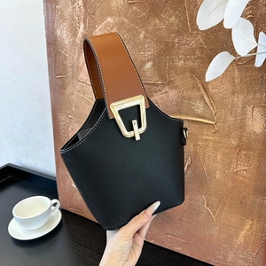 Litchi pattern leather bucket bag in black and brown contrast with gold buckle