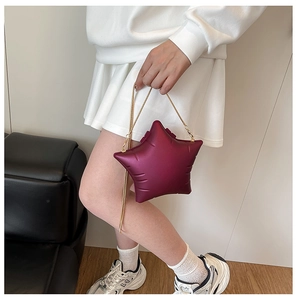 Star-shaped acrylic shoulder bag in deep purple with elegant gold chain strap details
