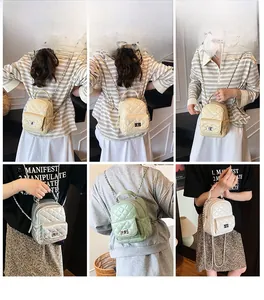 Quilted mini backpack and crossbody bag with chain strap shown in various styling options