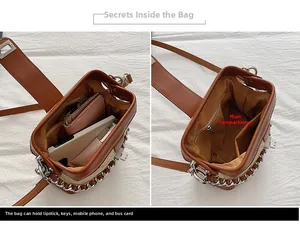 Detailed interior view of a contrast leather crossbody bag showing spacious main compartment