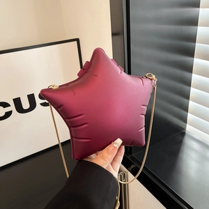 Deep burgundy star-shaped acrylic crossbody bag with matte texture and gold chain