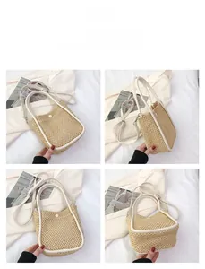 Detail of woven straw bucket bag with white leather trim and detachable shoulder strap
