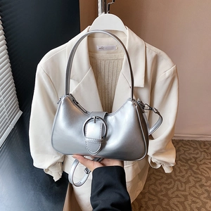 Silver metallic crescent hobo bag with large metal buckle and adjustable strap