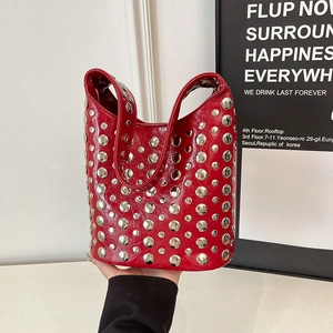 Vintage punk style red leather tote bag with silver metal studs and curved top handles