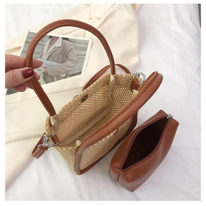 Detail view of woven mesh tote with inner zipper pouch and magnetic snap closure