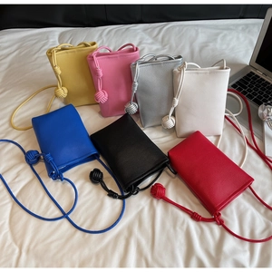 Detailed view of mini crossbody phone bags in seven colors with lychee texture leather
