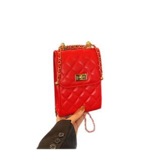 Classic red quilted chain bag with gold metal hardware and diamond pattern design