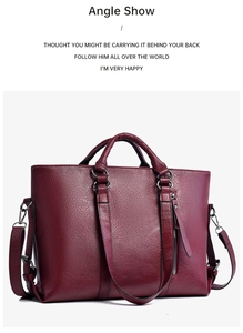 Detailansicht der burgunderroten Shopper-Tasche mit Lychee-Lederstruktur und Reißverschlüssen