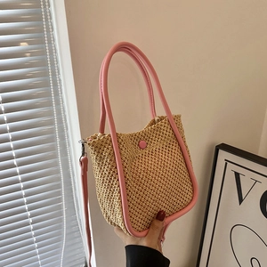 Summer woven handbag with pink leather trim and adjustable crossbody strap