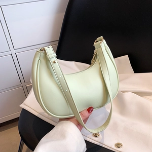 Mint green crescent shoulder bag with adjustable strap and gold zipper detail