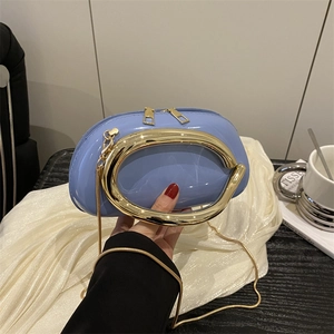 Light blue glossy evening clutch with a distinctive gold oval handle and chain strap