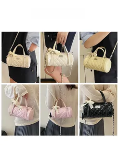 Quilted cylinder bag with lace bow detail shown in various fashion styling options