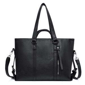 Large black leather tote bag with lychee texture and detachable shoulder strap on white base