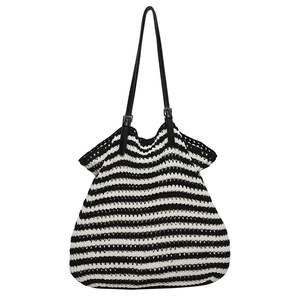 Handwoven striped tote bag with black and white patterns and adjustable leather strap