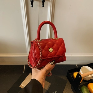 Mini red quilted handbag with gold flower clasp and chain strap for little girls