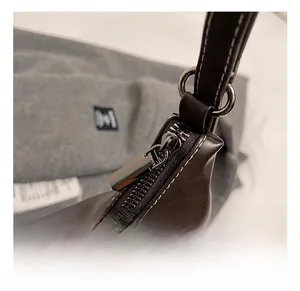 Detailed macro view of vintage brown leather texture and silver metal zipper hardware
