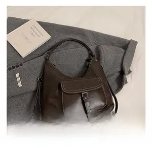Detail shot of the vintage dark brown PU leather backpack with a functional front buckle pocket