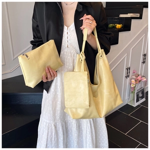 Three-piece bright yellow PU leather tote bag set including large shoulder bag and small pouch