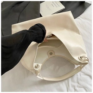 Detail view of large tote bag interior showing spacious compartment and zipper pocket