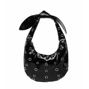 Minimalist black patent leather crescent shoulder bag with silver eyelets and knot strap