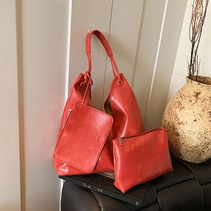Three-piece red PU leather tote bag set including shoulder bag and small pouch