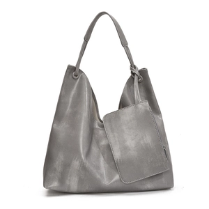Minimalist grey PU leather tote bag with small zipper pouch and knotted metal ring detail