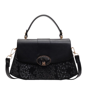 Chic black patchwork handbag with glossy leather and snake-print texture detail