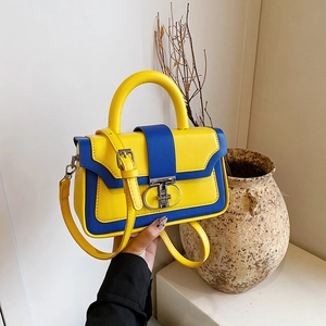 Retro contrast color crossbody bag in yellow and blue leather with metal buckle closure