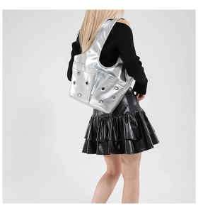 Silver metallic tote bag with eyelet details and wide shoulder strap in Y2K style