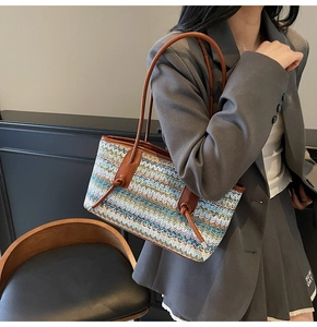 Detailed view of bohemian woven tote bag featuring multi-colored zigzag wave pattern