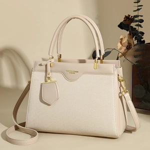 Elegant beige textured large capacity tote bag with adjustable shoulder strap for women