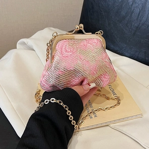 Elegant woven pink gold frame clutch with metallic clasp and chain strap for women